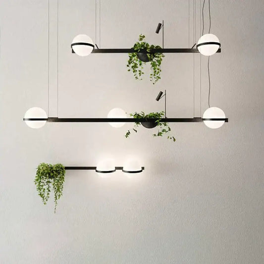 Modern black metal pendant light with frosted white bulbs and decorbites artificial plant pendant for nordic diy sky garden
