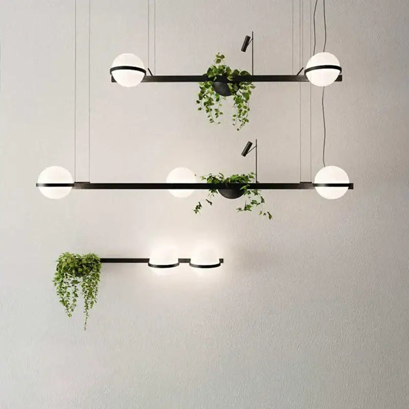 Modern black metal pendant light with frosted white bulbs and decorbites artificial plant pendant for nordic diy sky garden