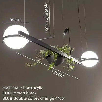 Modern matte black iron and acrylic pendant light with spherical white glass shades and decorbites artificial plant pendant