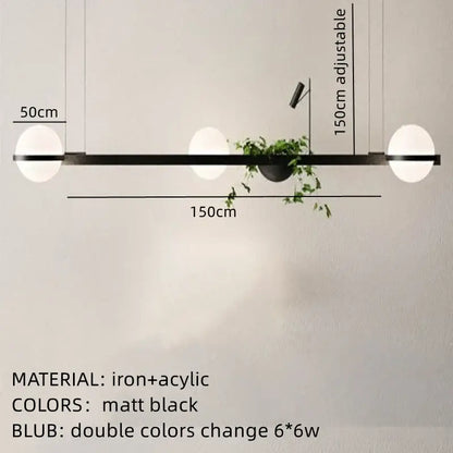 Matte black iron and acrylic pendant light with two spherical bulbs and central plant holder by decorbites artificial plant pendant