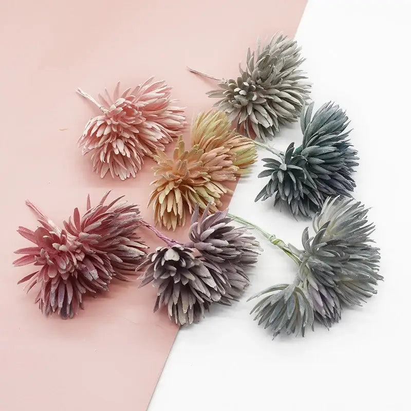 A collection of decorbites artificial plant fake flowers in muted pastel shades with textured petals for christmas decor