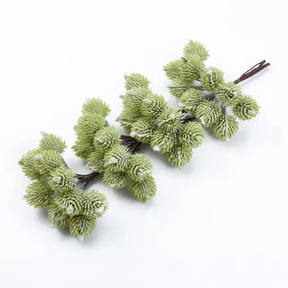 Light green artificial pine branch clusters with frosted tips made of synthetic fibers for decorbites artificial plants christmas decor