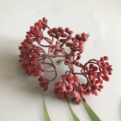 A cluster of red frosted artificial berries on brown stems from decorbites artificial plants diy dried plants garland decoration