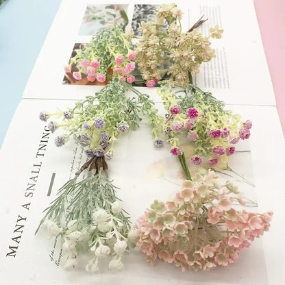 A decorbites™ artificial succulent tree featuring delicate pastel pink lavender and cream flowers with green foliage for home décor