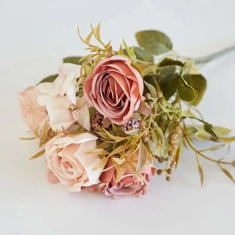 A delicate decorbites artificial western rose bouquet with blush and cream hues wedding decor accents