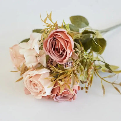 A delicate decorbites artificial western rose bouquet with blush and cream hues wedding decor accents
