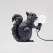 Black resin artistic squirrel night table lamp holding clear bulb compatible with 220v-240v and 110v-120v power