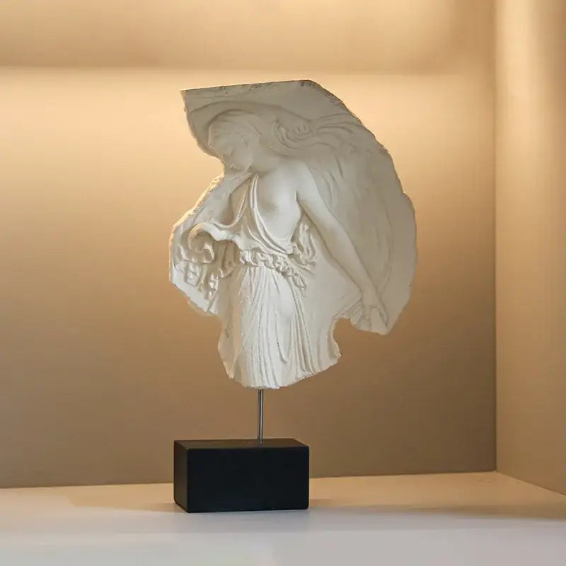 White marble decorbites artistic venus relief sculpture of a draped goddess figure on black rectangular base for home decor