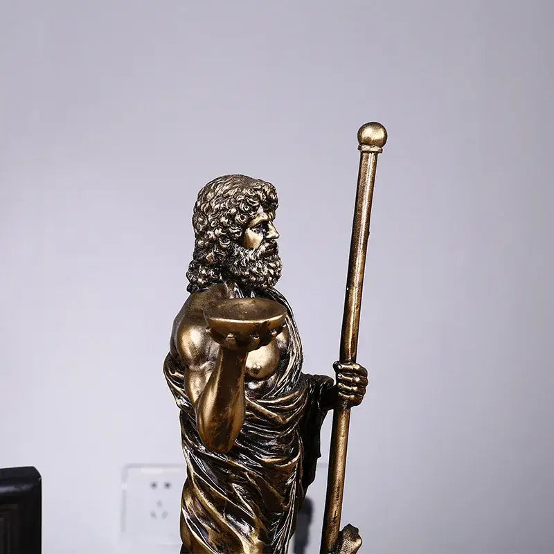 Bronze-colored resin asclepius mini statue of a bearded muscular figure holding a staff and offering bowl for decor