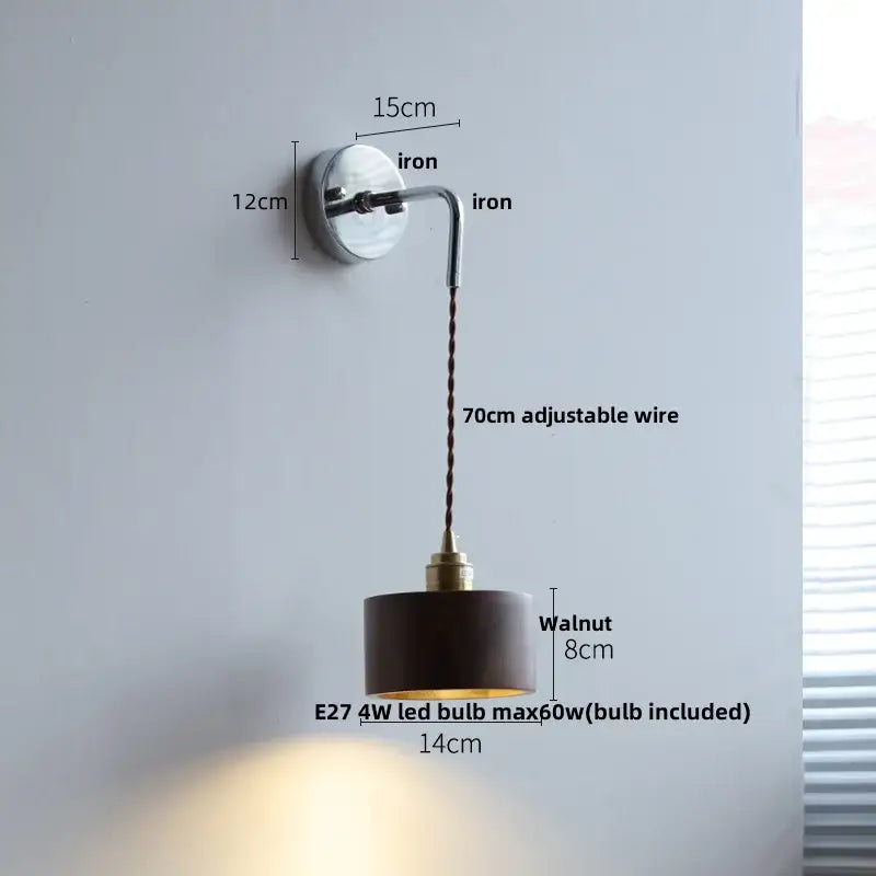 A sleek decorbites ash wood led wall light with a polished iron base and walnut-finished cylindrical shade for bedside use