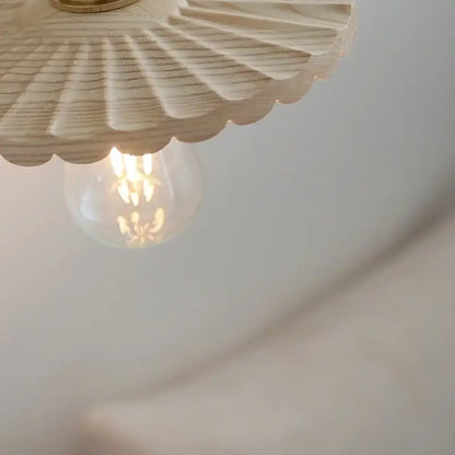 Decorbites ash wood led wall light with a cream wooden fan shape brass fixture and exposed filament bulb for living room use