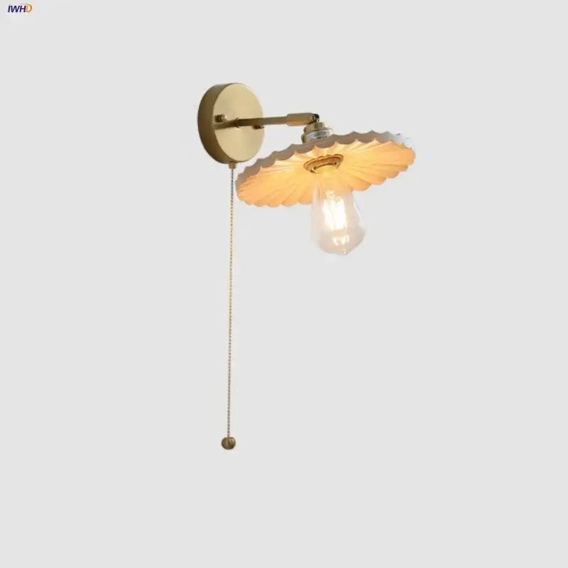 Vintage-style brass wall sconce with scalloped glass shade and exposed filament bulb for decorbites ash wood led lighting