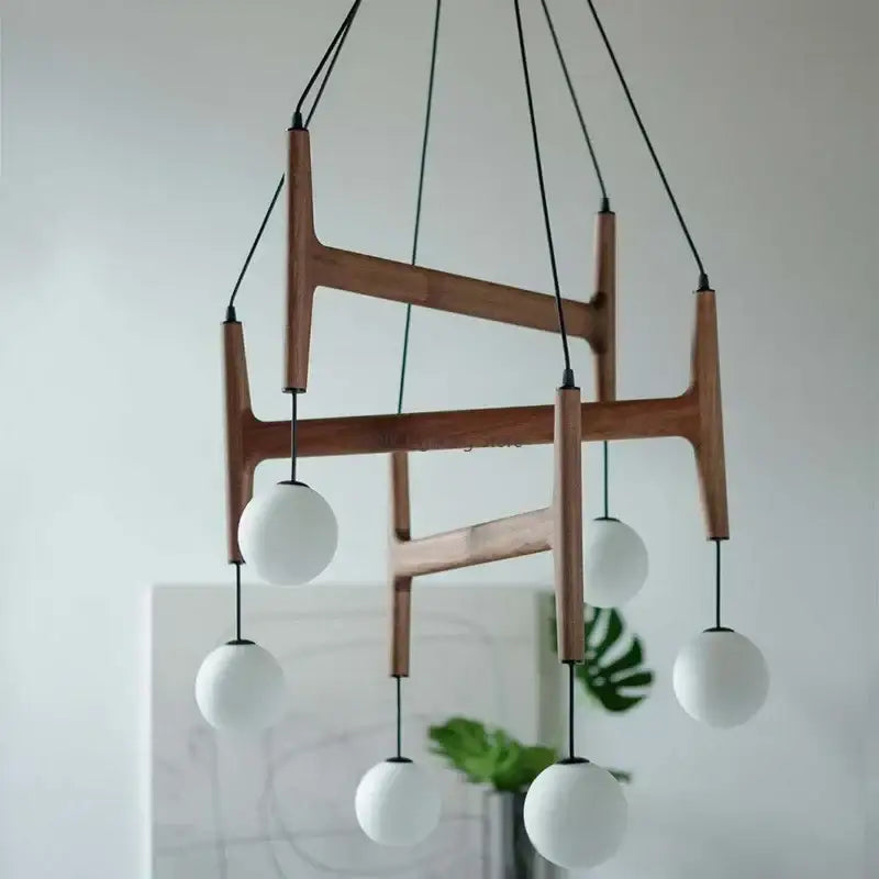 Modern wooden chandelier with five white glass shades and black cords decorbites astra wood pendant light interior lamp