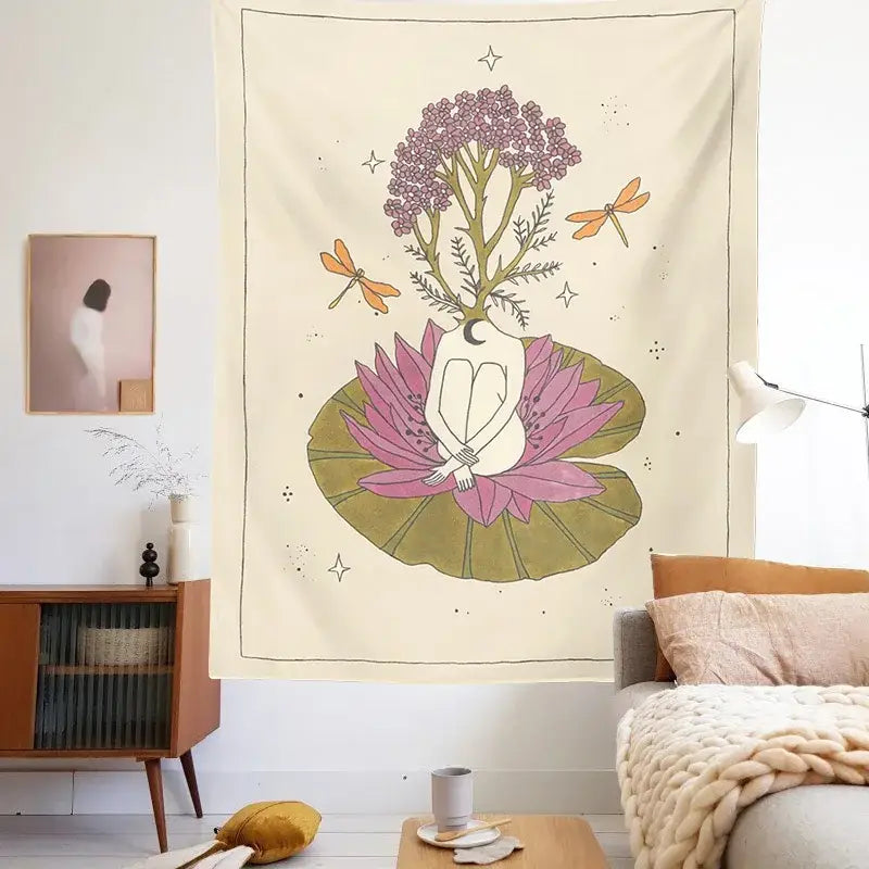 A cream-colored decorbites astrology tarot card tapestry featuring a whimsical sun moon goddess on a pink lotus with flowers and dragonflies