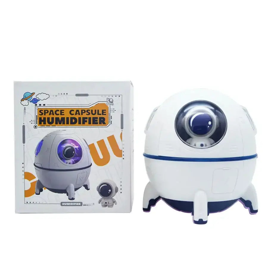 DecorBites astronaut air humidifier in white and navy blue with a glowing purple lens night light for kids