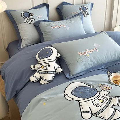 Blue cotton bedding set with astronaut cartoon embroidery and plush toy by decorbites for boys single bed