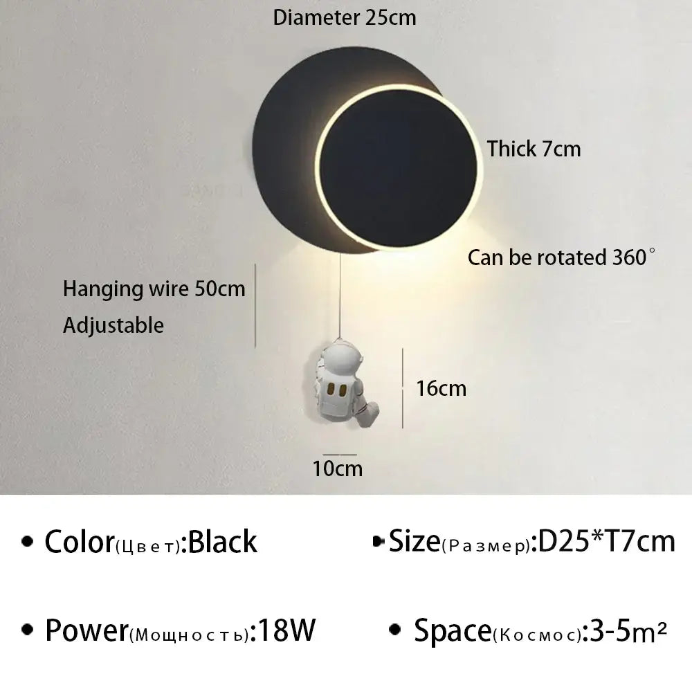 Black circular DecorBites astronaut cartoon wall lamp with glowing LED ring and adjustable hanging wire for modern decor
