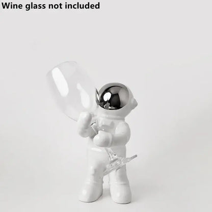 White ceramic astronaut figurine with reflective silver helmet holding a clear wine glass for decorbites astronaut ceramic wine rack