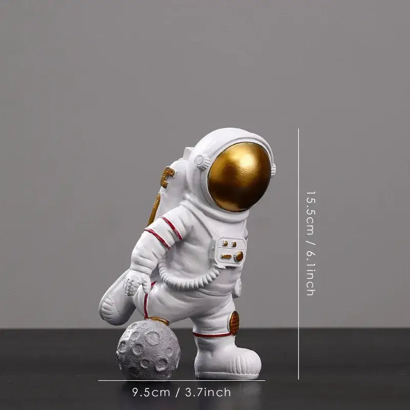 Decorbites astronaut figurine abstract sculpture featuring a white astronaut with gold visor on gray moon surface
