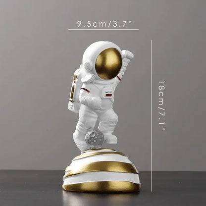 Decorbites astronaut figurine abstract sculpture in white with gold helmet and striped gold white base for modern decor