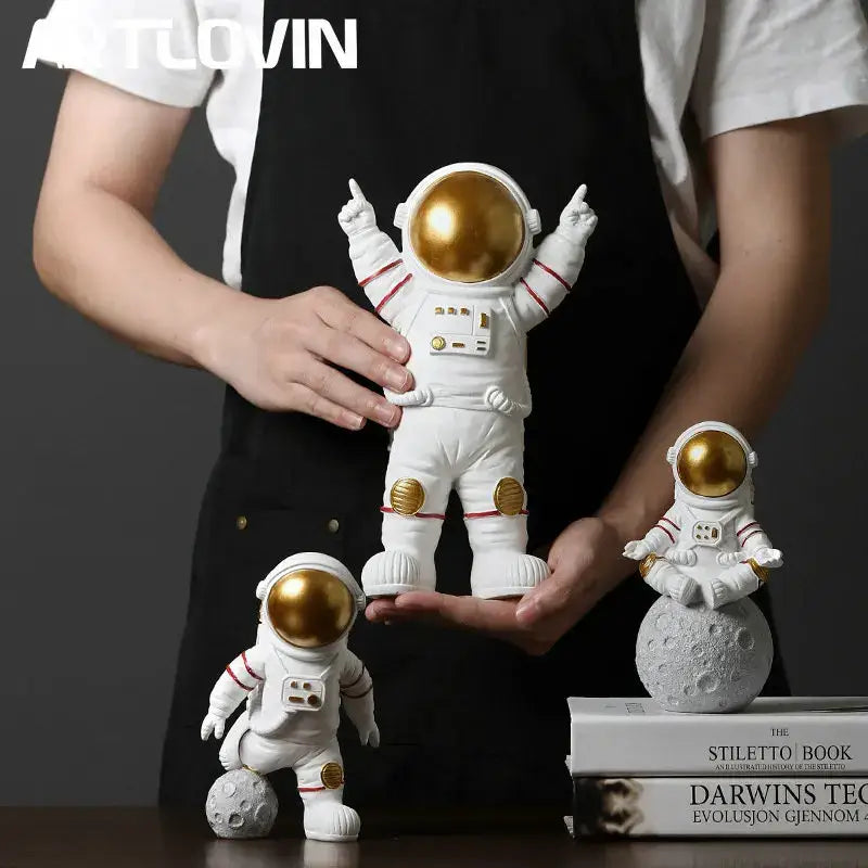Decorbites astronaut figurine abstract sculpture featuring a white suit with gold helmet and accents for modern decor