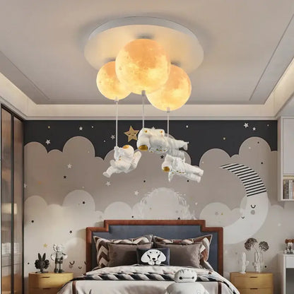 Whimsical decorbites astronaut globe ceiling light featuring three glowing yellow moons and floating white astronauts for kids room