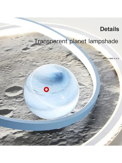 Decorbites astronaut led chandelier with transparent blue gradient lampshade and red dot over lunar surface backdrop