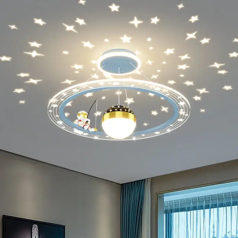 Decorbites astronaut led chandelier with gold and blue rings and glowing bulb featuring astronaut figurine fishing