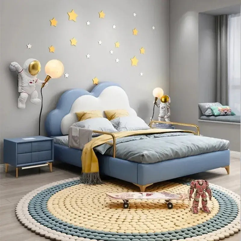Blue cloud-shaped bed with white accents and gold metal frame paired with decorbites astronaut led desk lamp