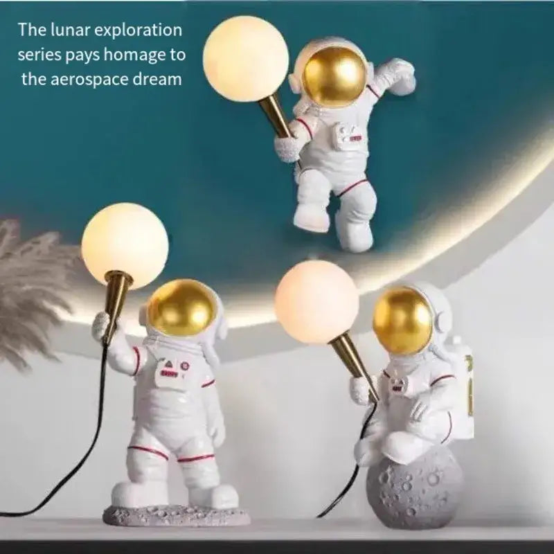 Decorbites astronaut led desk lamp featuring white resin figures with gold helmets holding spherical lamps for modern decor