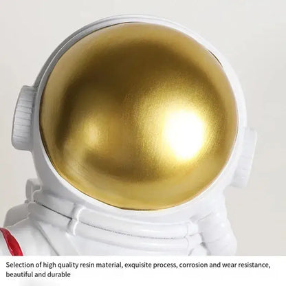 White astronaut led table lamp with shiny gold visor made of high-quality resin for space-themed kids room decor