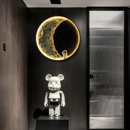 A white kaws be@rbrick figure on a dark pedestal beside the modern nordic resin decorbites led wall lamp