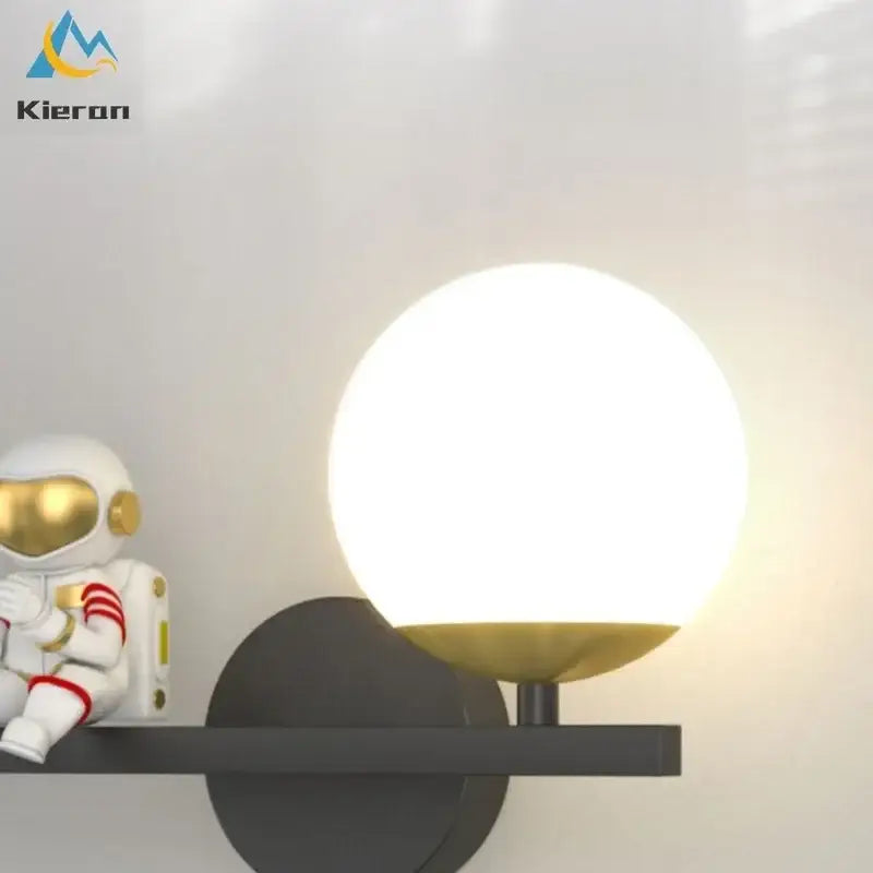 Modern spherical frosted glass decorbites astronaut led wall lamp with gold metal base on black bracket for bedroom decor