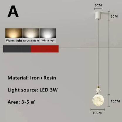 A white astronaut figurine stands atop a spherical iron and resin decorbites astronaut lunar pendant light with led bulb