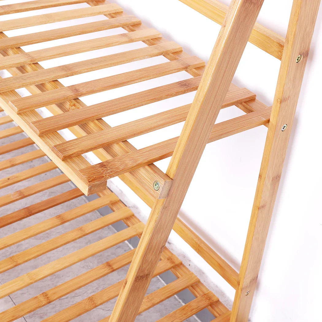 Light brown bamboo 3 tier folding shelf stand with slatted shelves and natural wood grain for plant pots