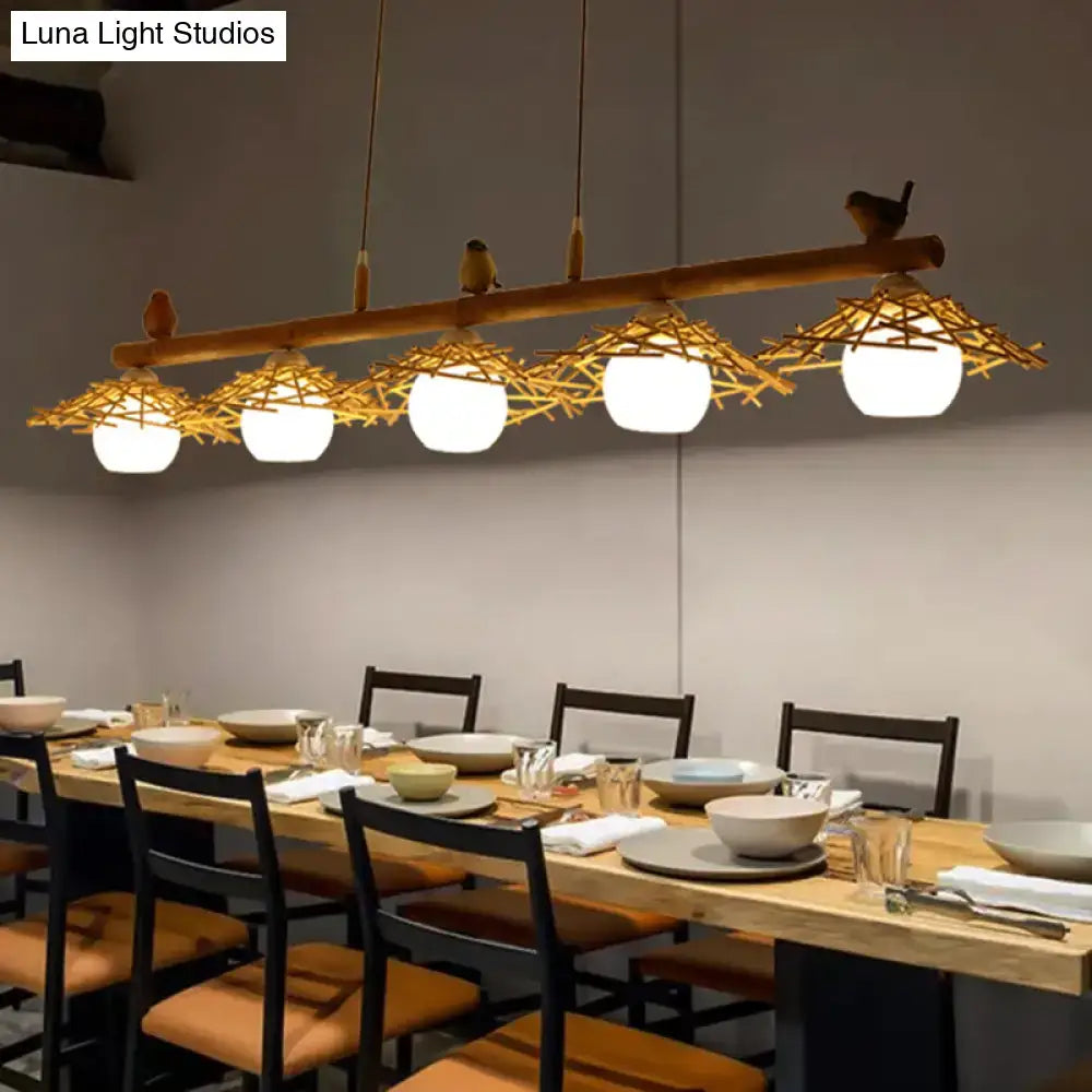 Decorbites bamboo pendant lighting with white glass shade featuring rustic woven basket shades and bird figurines in art deco style