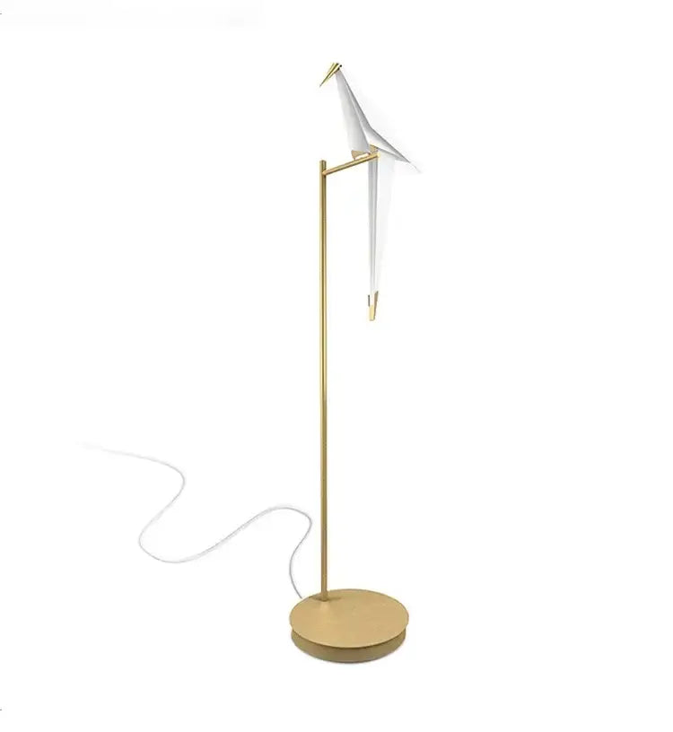 Gold-toned decorbites bird origami floor lamp with white origami crane perched on slender pole for living room lighting