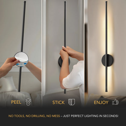 Modern stick-style decorbites black battery operated wall sconces set of 2 installed on a white wall