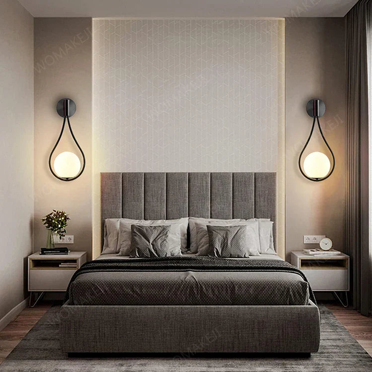 Gray upholstered bed shown alongside decorbites™ black battery operated wall sconces with remote and usb type-c charging