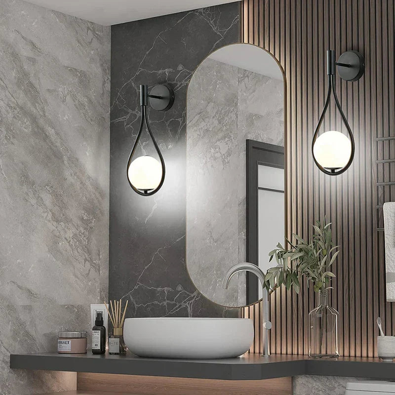 Decorbites black battery operated wall sconces with remote installed in modern bathroom vanity with usb type-c charging port