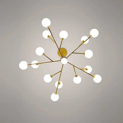 Gold-toned decorbites black chandelier with white frosted glass globe bulbs in a starburst design for living room lighting