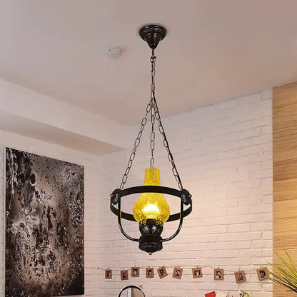 DecorBites black crackle glass pendant light with metal ring and glowing yellow bulb in classic vase shade design