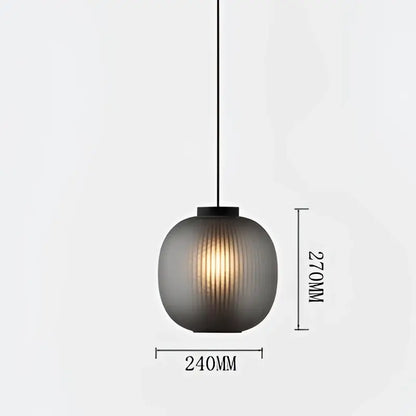 A sleek dark gray ribbed glass decorbites black glass ball table light with black metal fixture for bedroom and living room