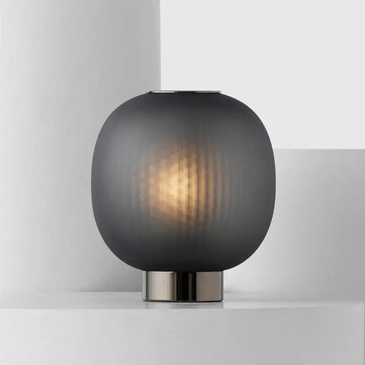DecorBites black glass ball table light with sleek dark gray frosted glass and brushed metal base for bedroom use