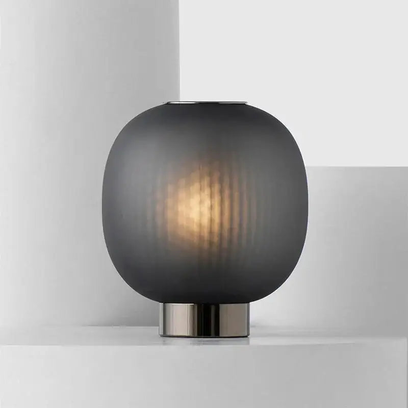 DecorBites black glass ball table light with sleek dark gray frosted glass and brushed metal base for bedroom use