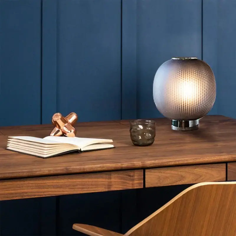 DecorBites black glass ball table light with textured spherical glass and warm glow on metallic base for bedroom and living room