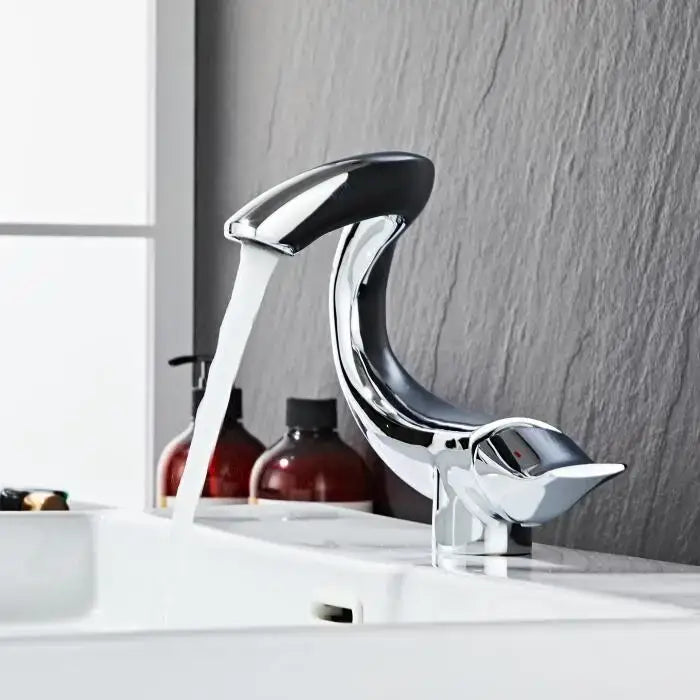 Chrome-finished sculpted decorbites black gold brass bathroom faucet mixer with sleek bird design in gold brass bathroom decor