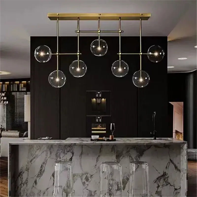 Decorbites black gold brass chandelier with clear glass globe bulbs on a gold-toned modern geometric frame