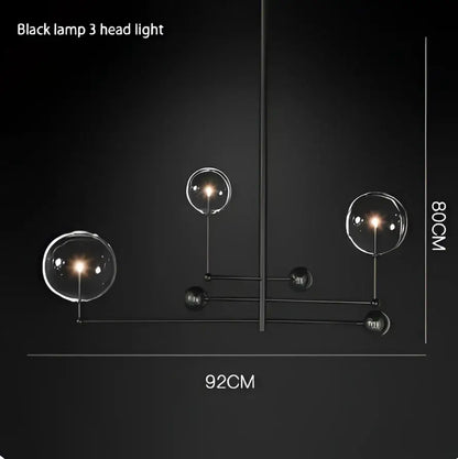 DecorBites black gold brass chandelier with three clear glass globe shades and vintage geometric lighting design