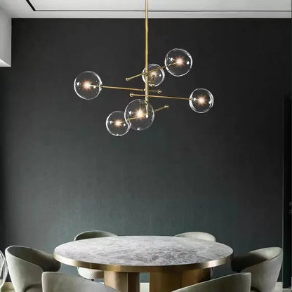 Brass-finished modern chandelier with clear glass globe bulbs in decorbites black gold vintage geometric lighting design